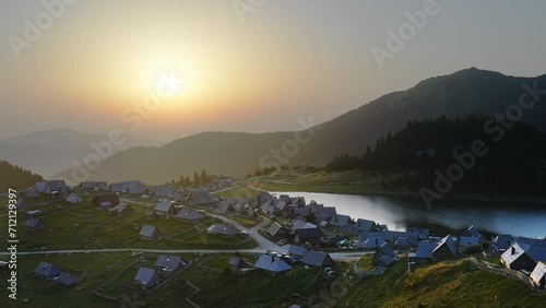 Mountain Village and a Lake in the Balkans at Sunrise. Vranica Mountain, Bosnia photo