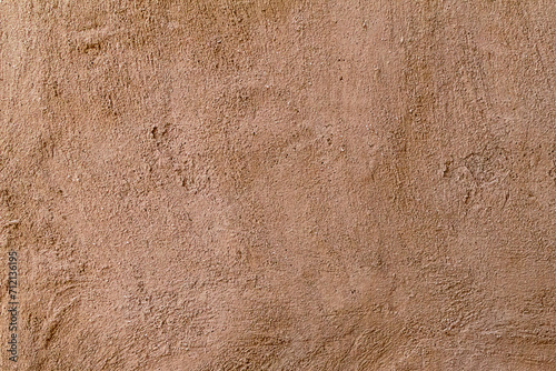 Old wall texture. Arabic heritage traditional house brown sandy plaster wall texture background.