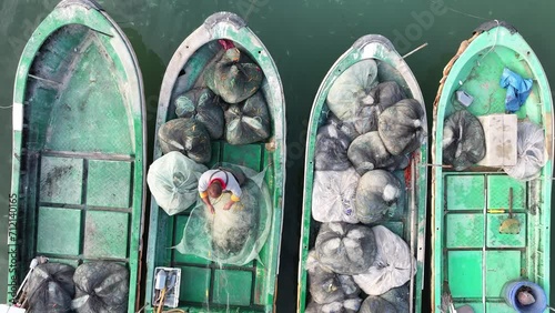 A fishman works on the boats, aerial view