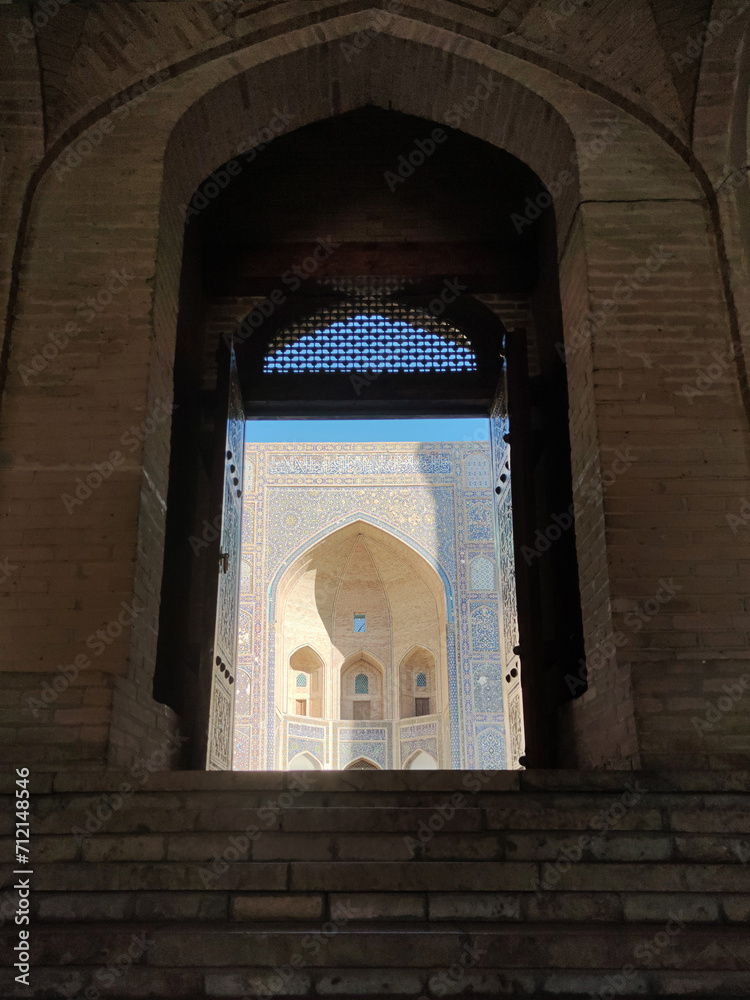 Naklejka premium old historical building with a beautiful Dome on the top with a beautiful Blue Marble designs in historical place, southern Uzbekistan, history of uzbekistan, historical tourism.