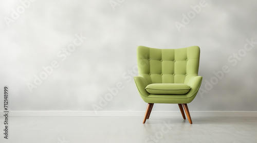 a Light Green chair in front of a white wall