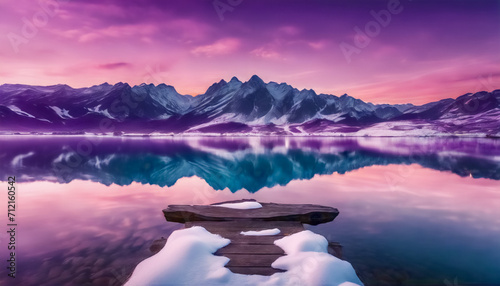Crepuscolo Nevoso al Lago di Montagna- Montagne Coperte di Neve, Mare Blu, Riflessi e Cielo Viola in un Tramonto Colorato photo