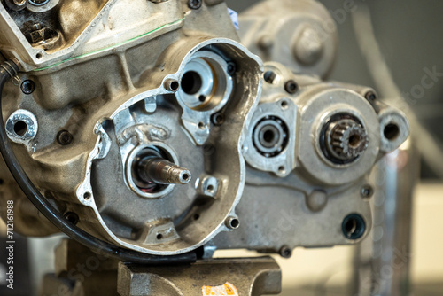 Vibrant snapshots capture the skilled artistry at a motorcycle repair workshop—mechanics in action, tools gleaming, and the hum of reviving engines photo