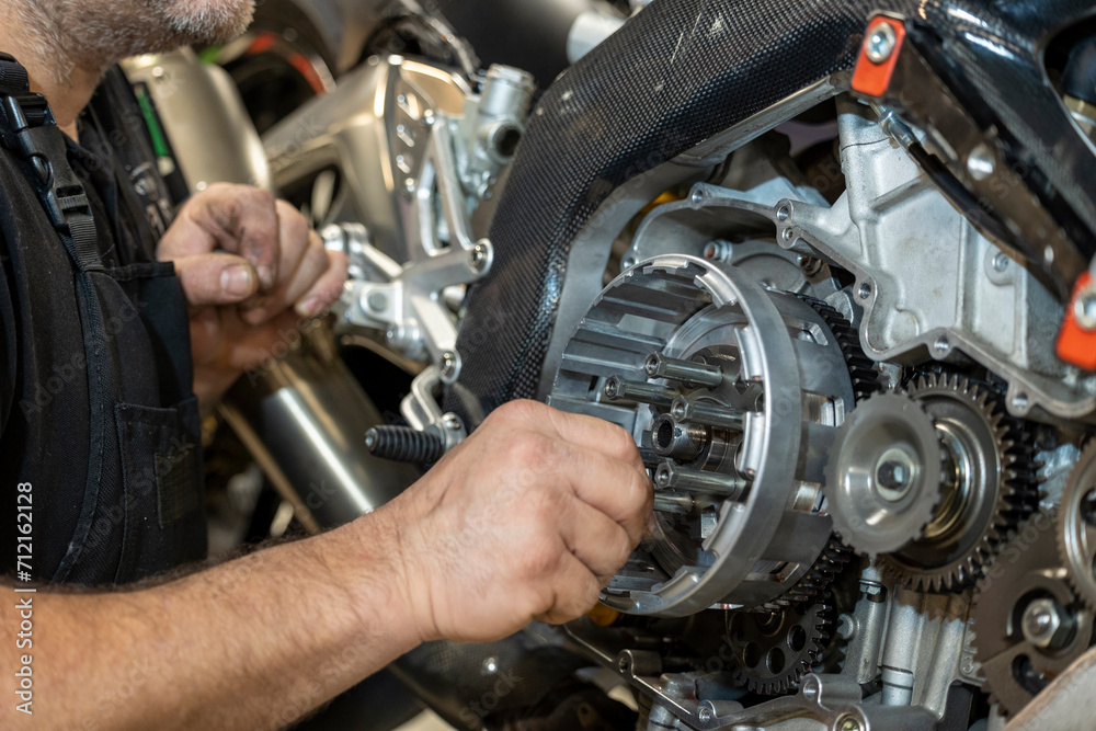 Vibrant snapshots capture the skilled artistry at a motorcycle repair workshop—mechanics in action, tools gleaming, and the hum of reviving engines Vibrant snapshots capture the skilled artistry at a motorcycle repair workshop—mechanics in action, tools gleaming, and the hum of reviving engines