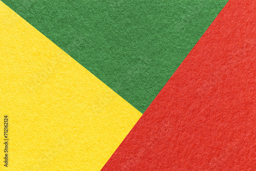 Texture of craft red, green and yellow shade color paper background, macro. Vintage abstract cardboard