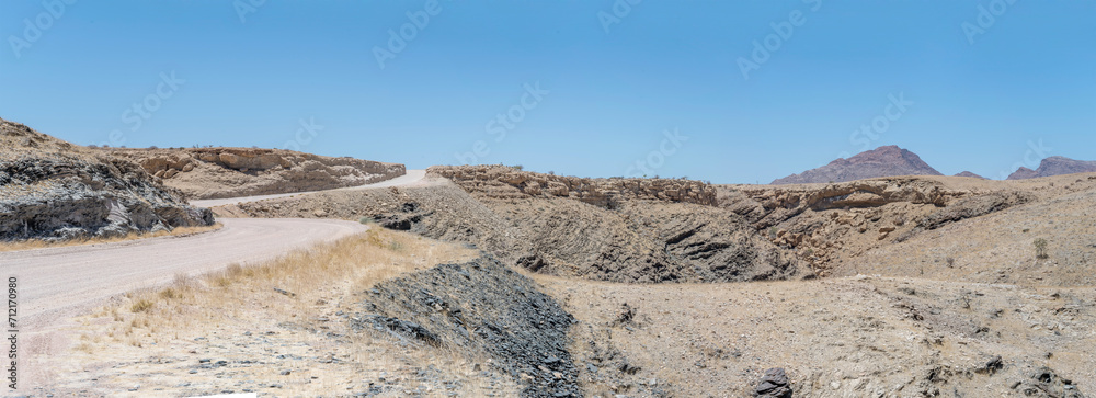 gravel road winding in Naukluft desert, near Gaub pass, Namibia