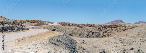 gravel road winding in Naukluft desert, near Gaub pass, Namibia photo
