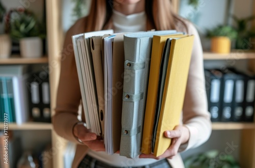 businesswoman at home office holding files with folders