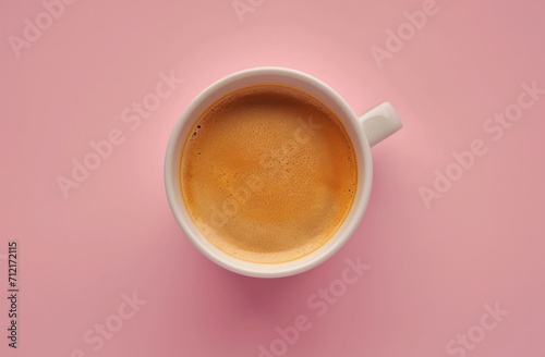 a cup of coffee is shown on a pink background