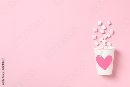 A heart made of sweet candies on a light background.