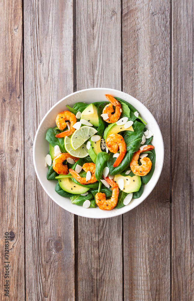 Salad with shrimps, avocado, spinach and almonds. Healthy eating. Diet. Salad with shrimps, avocado, spinach and almonds. Healthy eating. Diet.