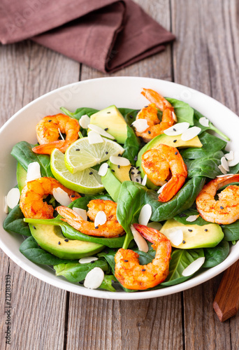 Salad with shrimps, avocado, spinach and almonds. Healthy eating. Diet.