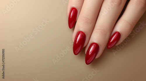 Beautiful red manicure on a gentle light background