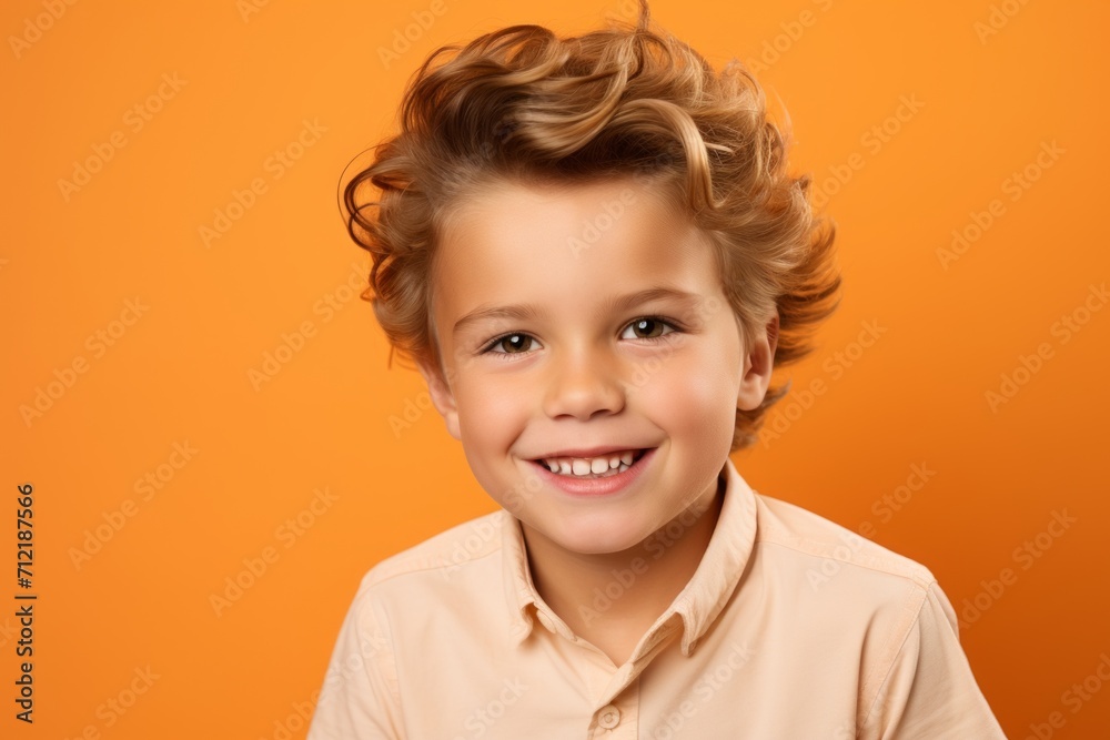 Portrait of a cute smiling little boy, isolated on orange background. Portrait of a cute smiling little boy, isolated on orange background.