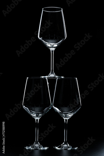 silhouette of wine glasses on black background