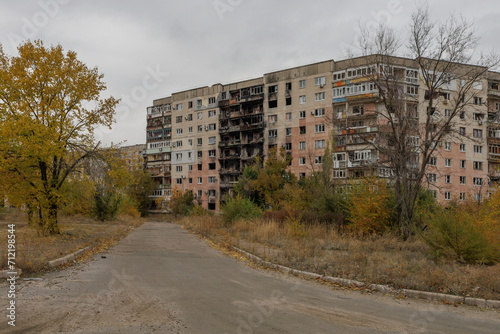 Destroyed and abandoned residental building during war in Ukraine.
