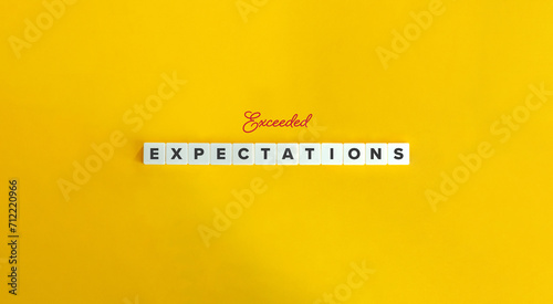 Exceeded Expectations Concept Image. Letter Tiles on Yellow Background. Minimalist Aesthetics. photo