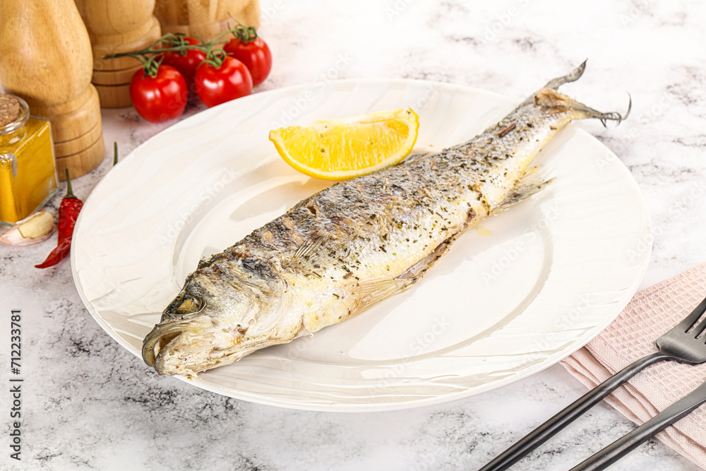 Grilled sea bass fish served lemon Grilled sea bass fish served lemon