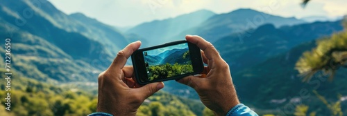 Photo of a mountain landscape on a smartphone from hands