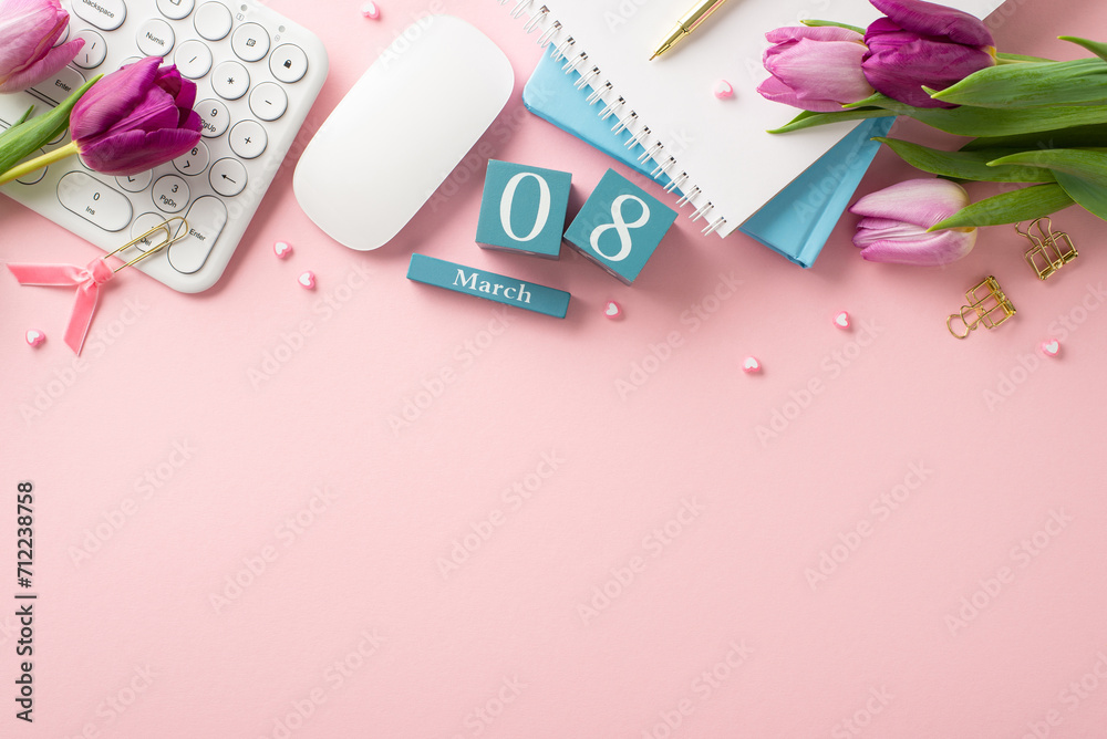 March 8th Desk: Capturing essence of Women's Day at the office – a top view of desk arrangement with a keyboard, mouse, cube calendar, trendy notepads, gold pen, binder clips, hearts and lilac tulips