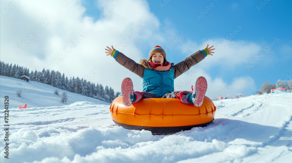 A woman having fun as she rides a tube down a snow-covered slope.