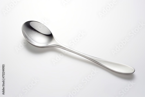 Shiny silver spoon isolated on white background
