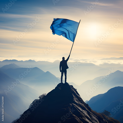 Silhouette of man holding blue flag on top of mountain, achievement and success concept, generative ai © Panoy