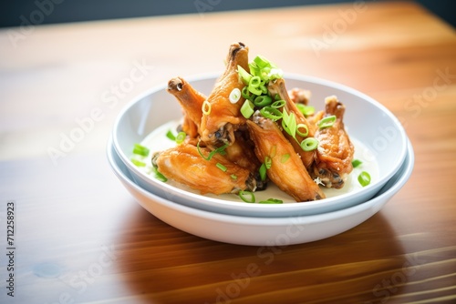 chicken wings with green onions and dipping sauce