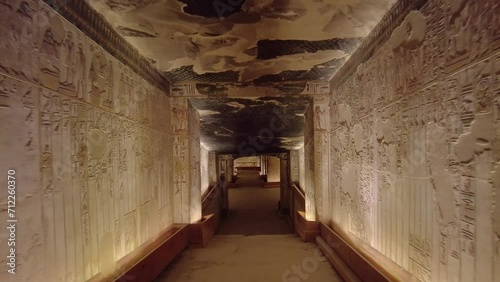 Luxor, Egypt - November 25 2023: Point of view of a tourist who walks into the interior of the famous Seti the first tomb in the valley of Kings in Luxor in Egypt.  photo