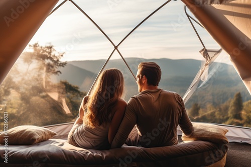 Young couple in geo dome tents