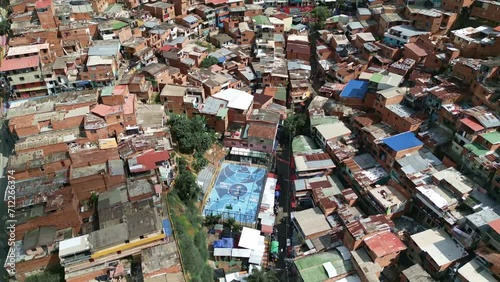 High Aerial Drone View of a Street Football Field in Comuna 13 Neighborhood, Medellin, Colombia.