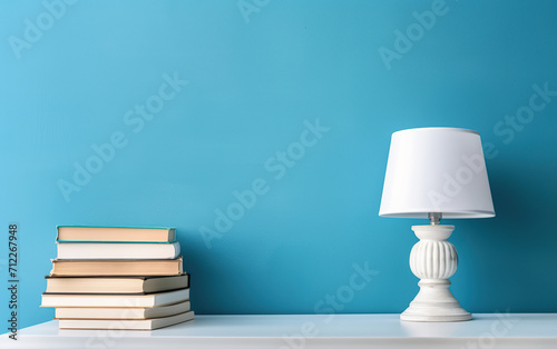 Modern style of white lamp and books on blue background