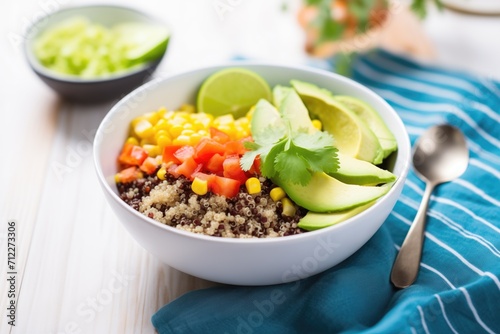 vegan quinoa bowl with black beans and corn photo