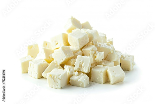 Piled feta cubes on white background