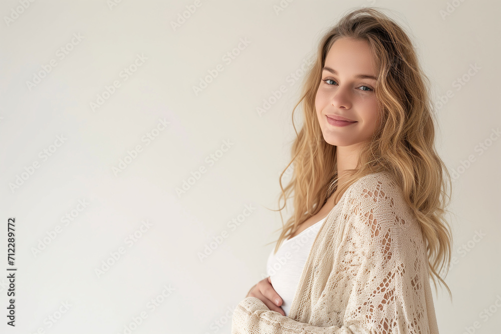 Portrait of beautiful young pregnant woman touching belly standing on colour background Portrait of beautiful young pregnant woman touching belly standing on colour background