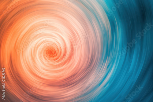 Swirling background of peach colour graduating in circular motion into light blue texture