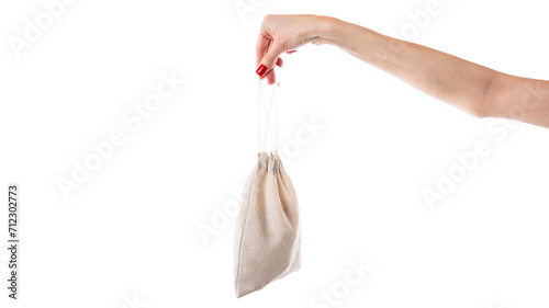 The pouch with geometric balancing wooden stones. Concept of balance. Balance game. Isolated on white background.