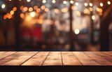Empty wooden table top with defocused bokeh. background Image of wooden table in front of abstract blurred restaurant lights
