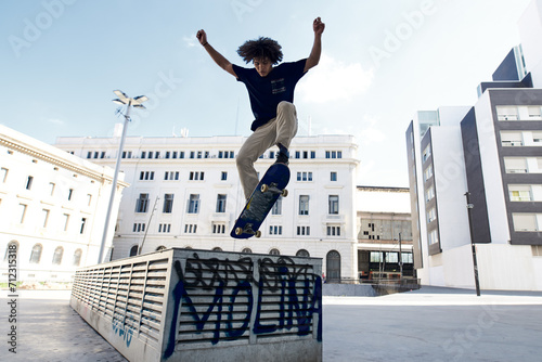 Skater performing flip on skateboard.