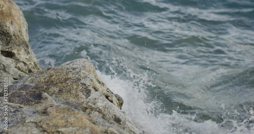 close up of waves crashing on rocks