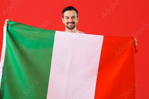 Handsome man with flag of I...