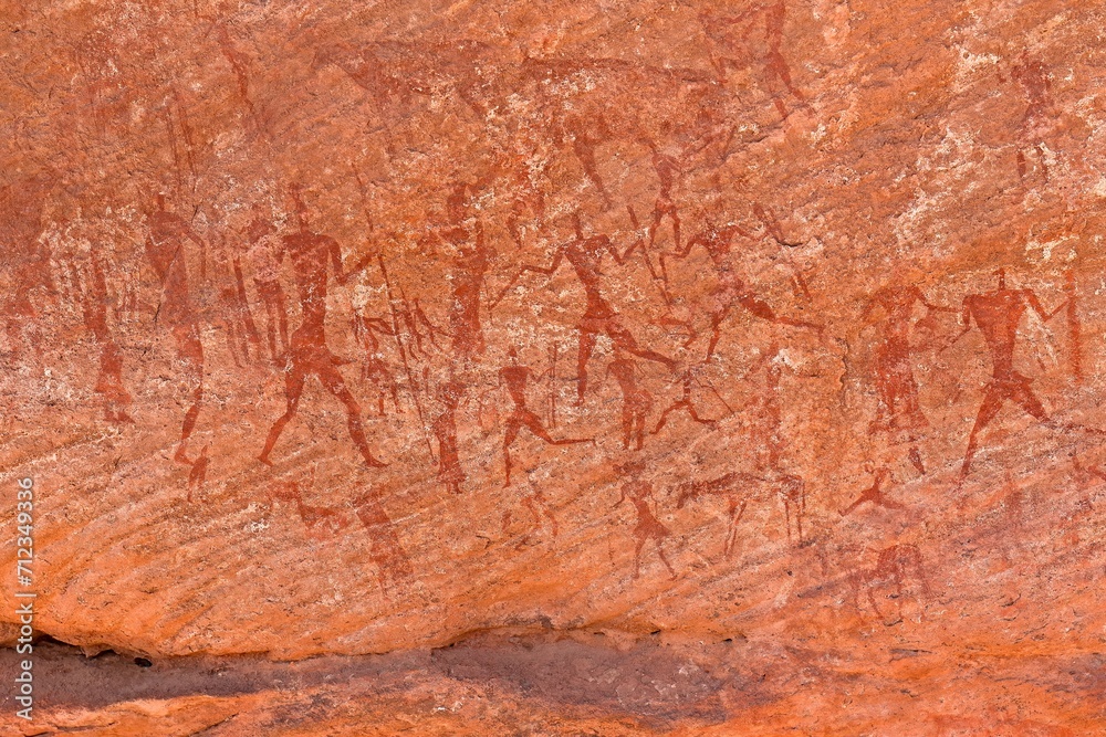Rock art, petroglyph from the Neolithic period, depictions of human figures, Bouhadian rocks in Tadrart Rouge, Tassili N'Ajjer National Park. Sahara, Algeria, Africa.