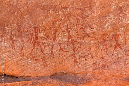 Rock art  petroglyph from the Neolithic period  depictions of human figures  Bouhadian rocks in Tadrart Rouge  Tassili N Ajjer National Park. Sahara  Algeria  Africa.