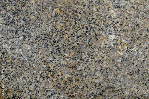 Struktura otoczaka kamienia w zbliżeniu makro, szare tło 
