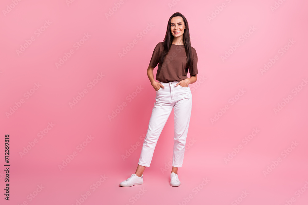 Full body portrait of gorgeous cheerful lady put hands pockets posing empty space isolated on pink color background Full body portrait of gorgeous cheerful lady put hands pockets posing empty space isolated on pink color background