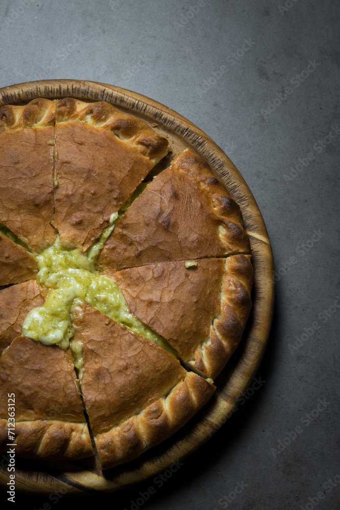 Ossetian pie is cut into pieces Ossetian pie is cut into pieces