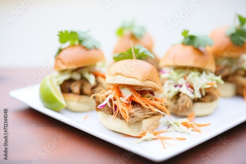 platter of carnitas sliders with spicy slaw for catering