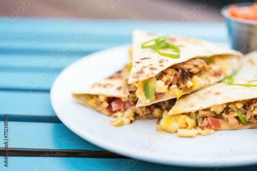 quesadilla filled with sausage and scrambled eggs
