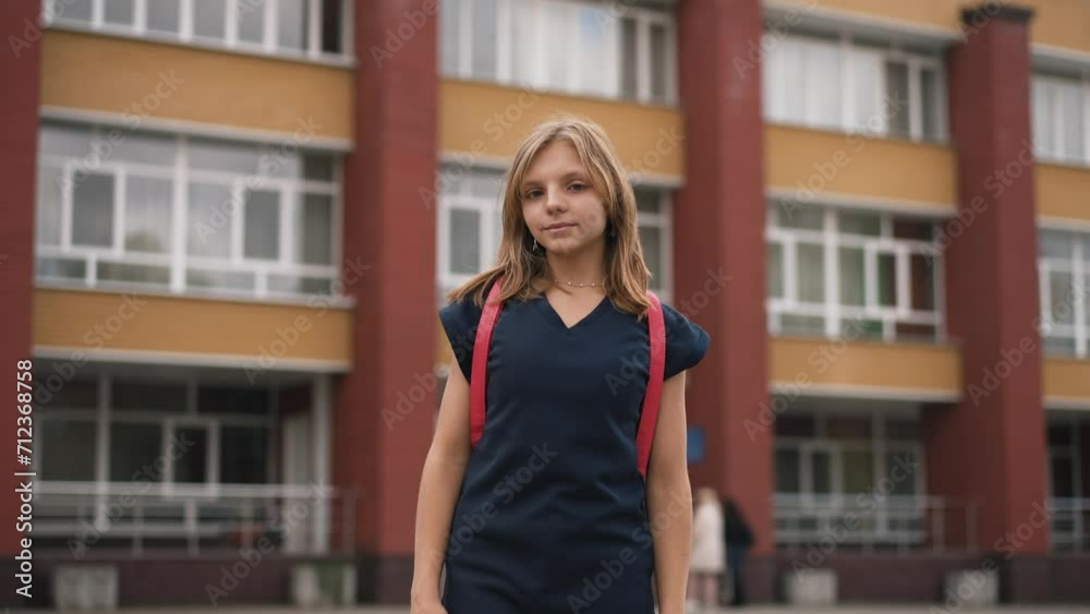 Teen girl in a front of the school Teen girl in a front of the school