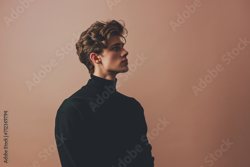 fashion young man in a studio muted color background and minimalistic